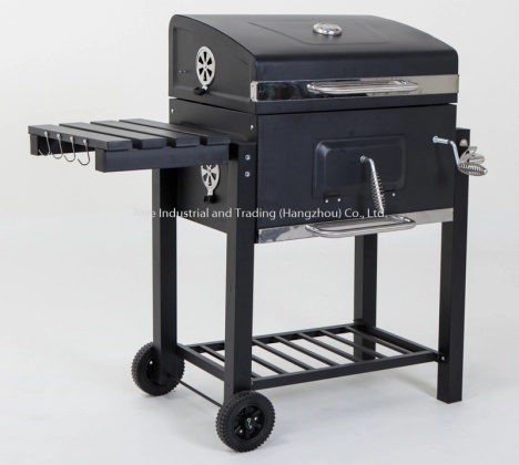 Outdoor grill covered for weather protection with cleaning tools nearby