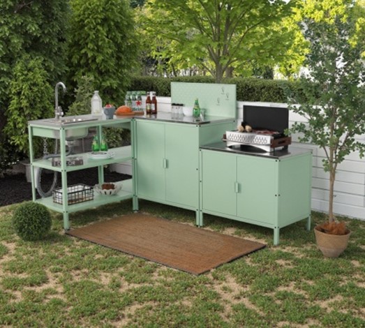 Module count, cabinet storage, sink placement, and grill position are the visible cost drivers buyers compare first